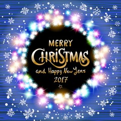 Merry Christmas and Happy New Year 2017. Glowing Christmas wreath made of led lights on the blue wooden background. Christmas lights background.