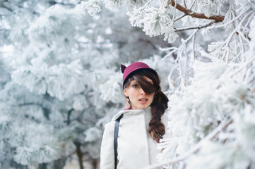 Attractive young woman in wintertime outdoor