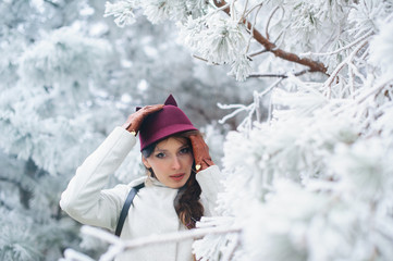 Fototapeta premium Attractive young woman in wintertime outdoor