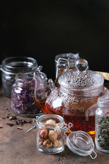 Variety of dry tea with teapot