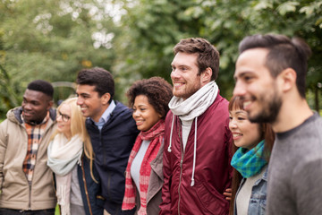 group of happy international friends outdoors