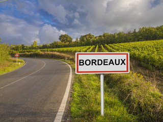 Obraz premium Road sign indicating that you're about to enter the wine region of Bordeaux, France
