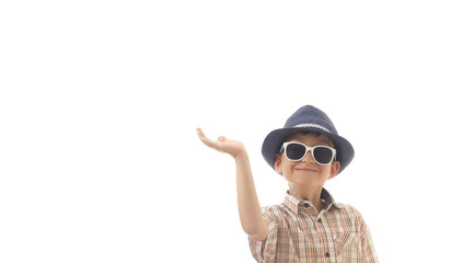 Caucasian kid with hat and sunglasses holding his hand up. Isolated on white background. Space for copy or other design.Business concept.