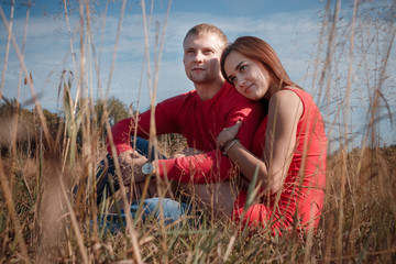 the loving couple walks on the wheat field