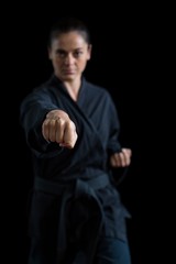 Female karate player performing karate stance