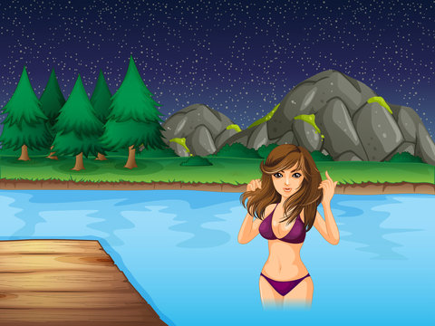 Beautiful woman in bikini swimming in the lake