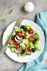Vegetable salad with romaine lettuce,tomatoes,cucumber and black