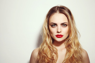 Vintage style portrait of young beautiful girl with long messy hair and red lips