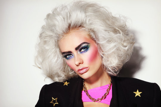 Portrait Of Young Beautiful Platinum Blond Woman With Bold Eyebrows And 80s Style Makeup