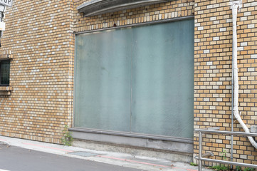 Large blank billboard on a street wall, banners with room to add your own text