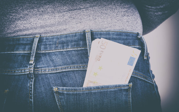 euro sticking out of his pants pocket