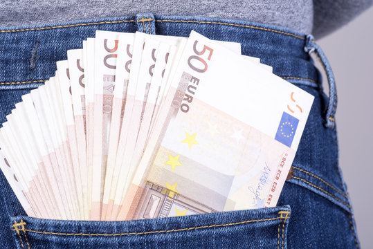 euro sticking out of his pants pocket