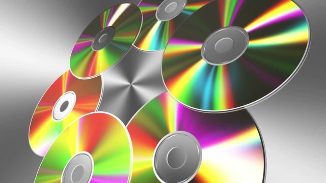 Rotating CD-DVD Discs Over Metal Background. 4K. 3840x2160. Seamless Looped 3D Animation.