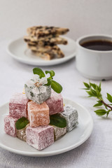 Rahat delight with tea for breakfast. White background