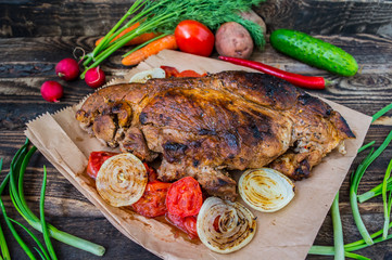 Grilled steak with  vegetables. On a wooden background. Top view