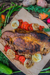 Grilled steak with  vegetables. On a wooden background. Top view