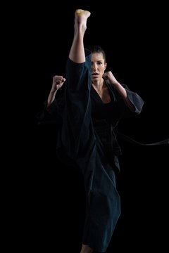 Female karate player performing karate stance © WavebreakMediaMicro