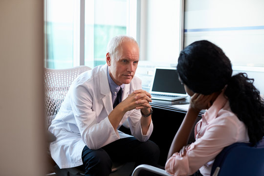 Doctor In Consultation With Depressed Female Patient