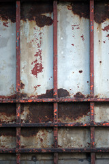 Abstract vintage steel door eroding rust.