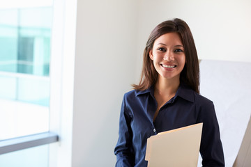 Portrait Of Female Doctor In Exam Room