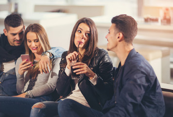 Young friends having a great time in restaurant