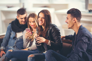 Young friends having a great time in restaurant