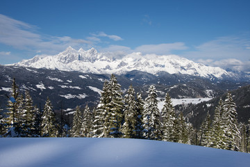 View over Austrian Alps mountain on sunny day with a beautiful blue sky.