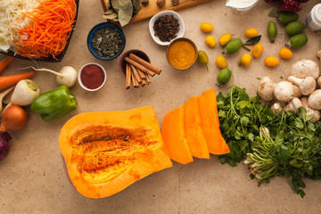 Sliced pumpkin, prepared for cooking healthy vegetarian meal. Ingredients to cook fool of vitamins food.
