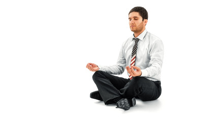 Businessman meditating in lotus pose