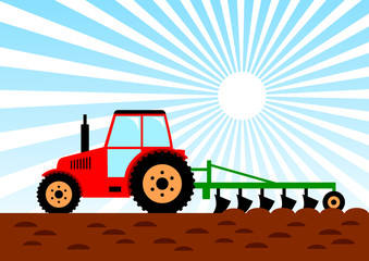 Agricultural work, red tractor on field