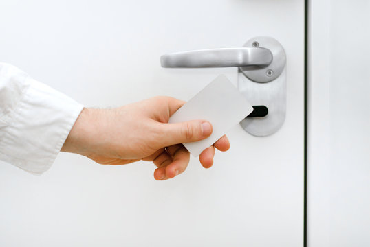 Man using contactless key in the hotel.