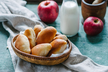 Breakfast with patties with apples in a wicker basket