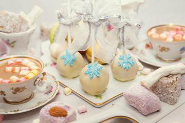 Winter table appointments with macaroons and sweets