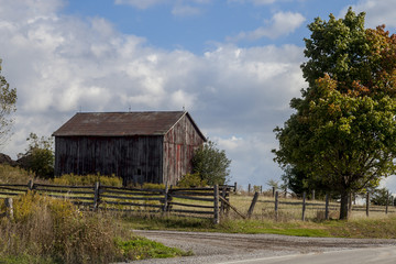 small barn by the side of the road