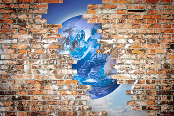 Through a cracked wall you can see the world - freedom concept imafe with image from NASA