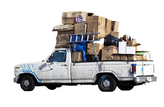 Entrepreneur's Beat Up Pickup Truck Filled With Recyclable Cardboard. Isolated.