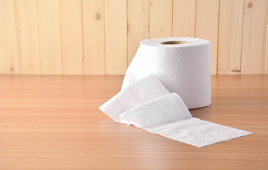 the tissues put on the brown wood table.