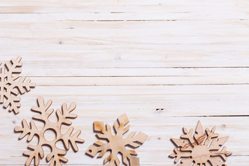 Snowflakes on wooden background