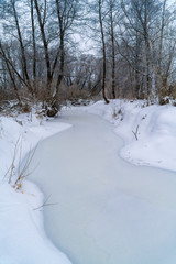 Winter landscape with frozen river