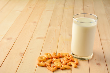The glass milk and cookies are placed in front.