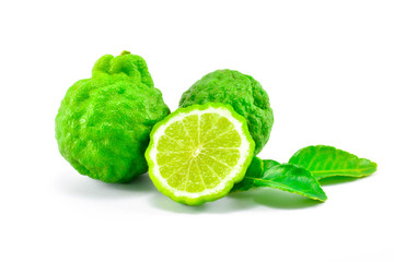 The green kaffir lime, half kaffir lime and leaf of kaffir lime on white background isolate.