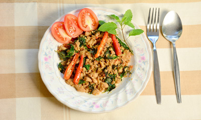 Rice topped with stir-fried pork and basil.