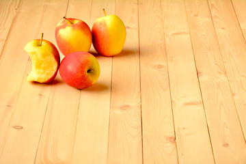 Apple on wood table at the morning.