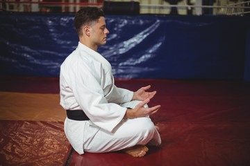Karate player doing yoga