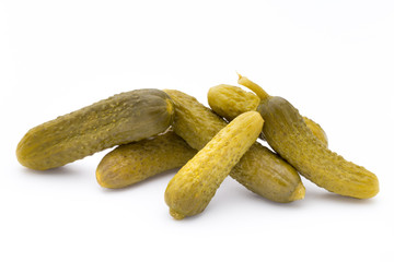Marinated pickled cucumbers isolated on the white.