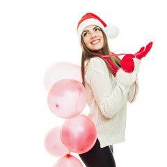 Cheerful young woman with balloons in Santa hat