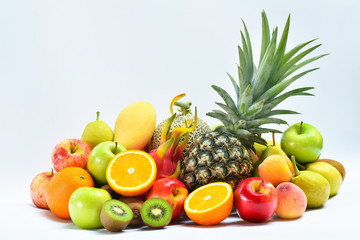 Group of tropical ripe fruits on white background