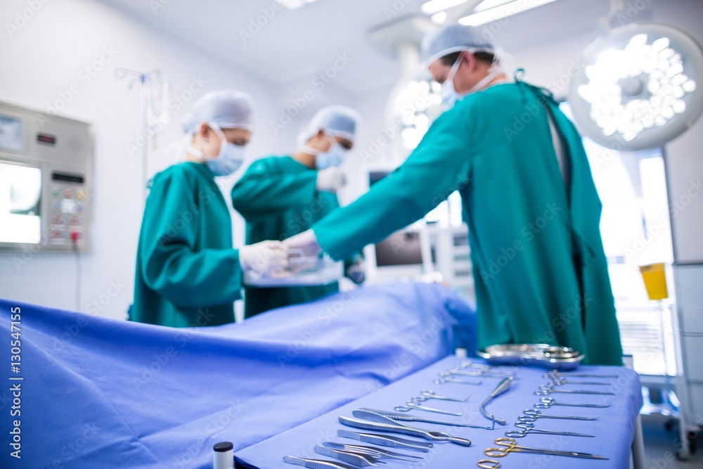 Poster surgeons performing operation in operation theater