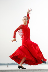 Flamenco dancer Spain woman in a long red dress