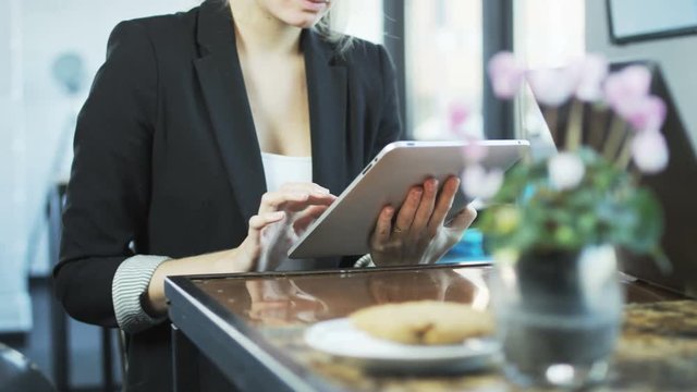 Business People Are Using Tablet and a Laptop
